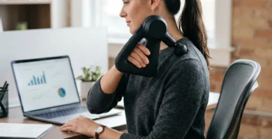 Person using a muscle recovery tool after desk work to relieve everyday tension